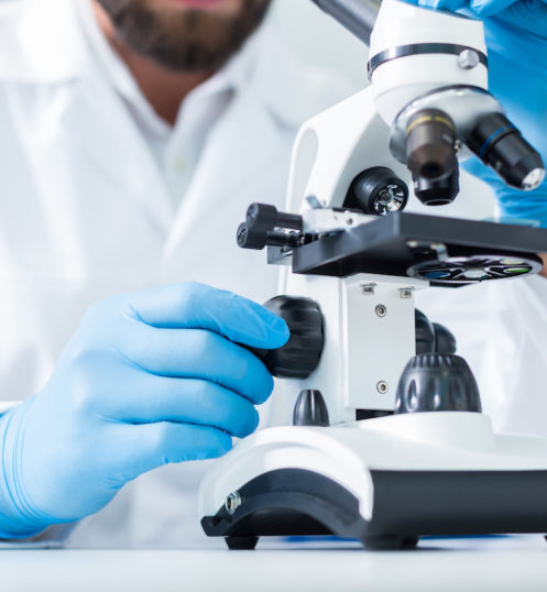 Close up of a professional microscope Laboratory equipment. Close up of a professional microscope being used for scientific research in the lab